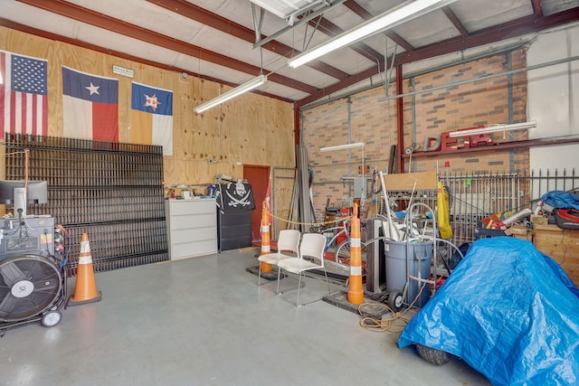 garage featuring wooden walls