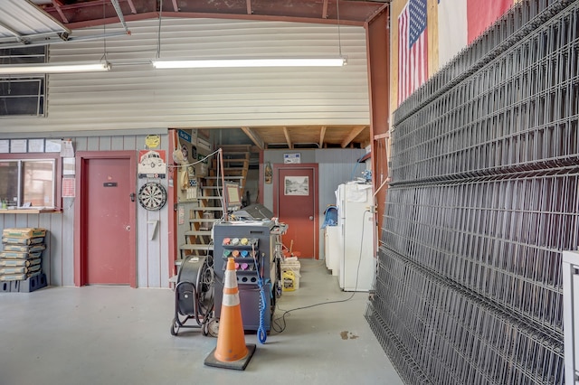 garage featuring white fridge