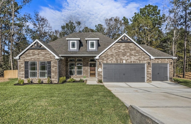 view of front of house featuring a garage and a front lawn