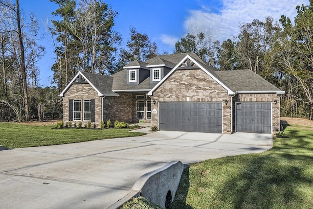 view of front of home with a garage and a front yard