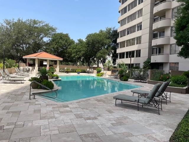 view of swimming pool featuring a gazebo and a patio