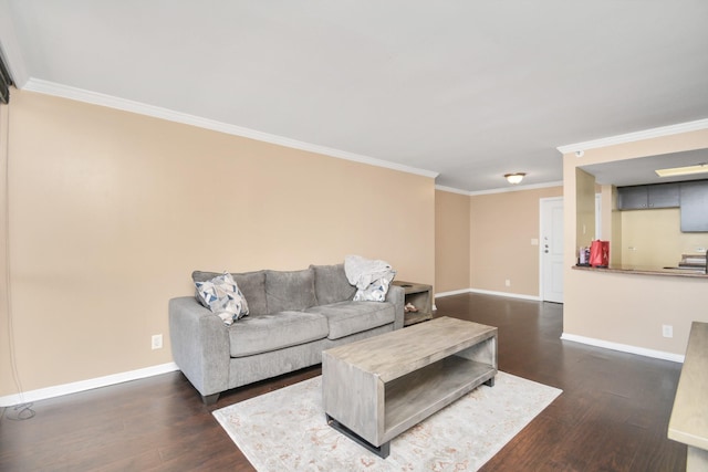 living room featuring dark hardwood / wood-style flooring and ornamental molding