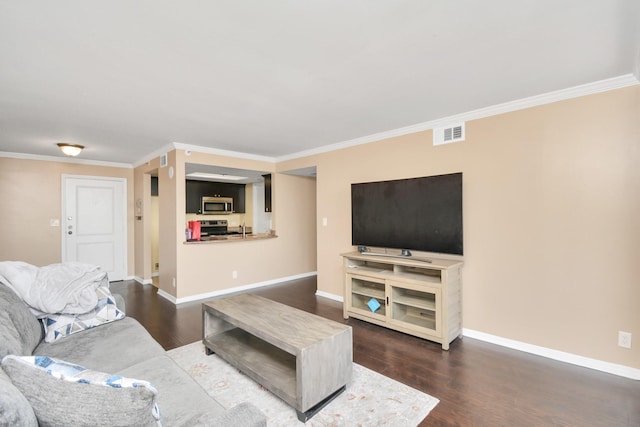 living room with crown molding and dark hardwood / wood-style floors