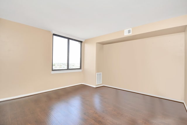 unfurnished room featuring hardwood / wood-style floors