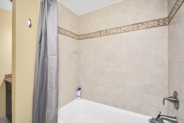 bathroom with shower / bath combo and vanity