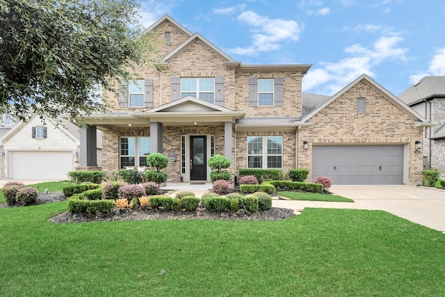 craftsman inspired home featuring a front yard and a garage