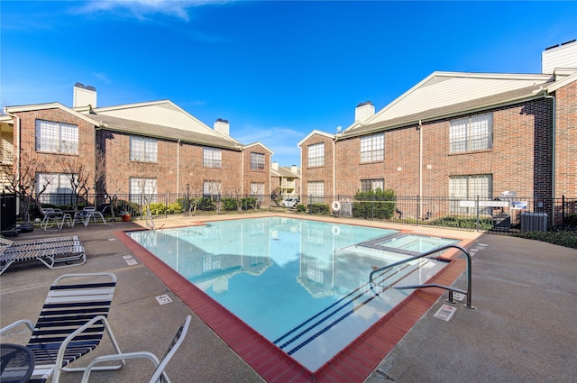 view of swimming pool with a patio area and central AC