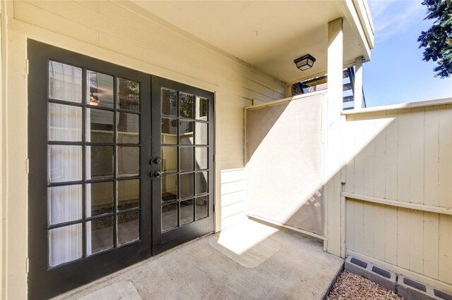 view of exterior entry featuring french doors