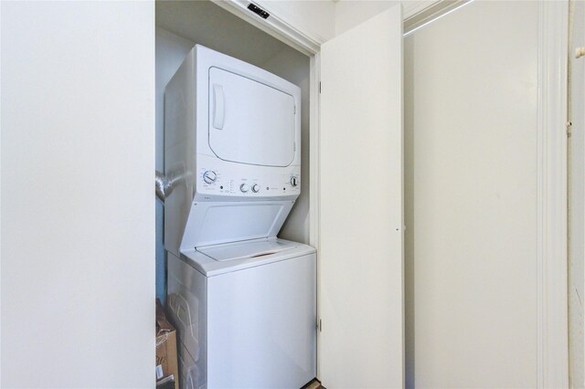 washroom with stacked washer and dryer