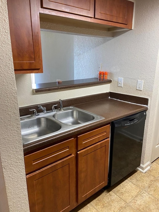 kitchen with dishwasher, light tile patterned floors, and sink