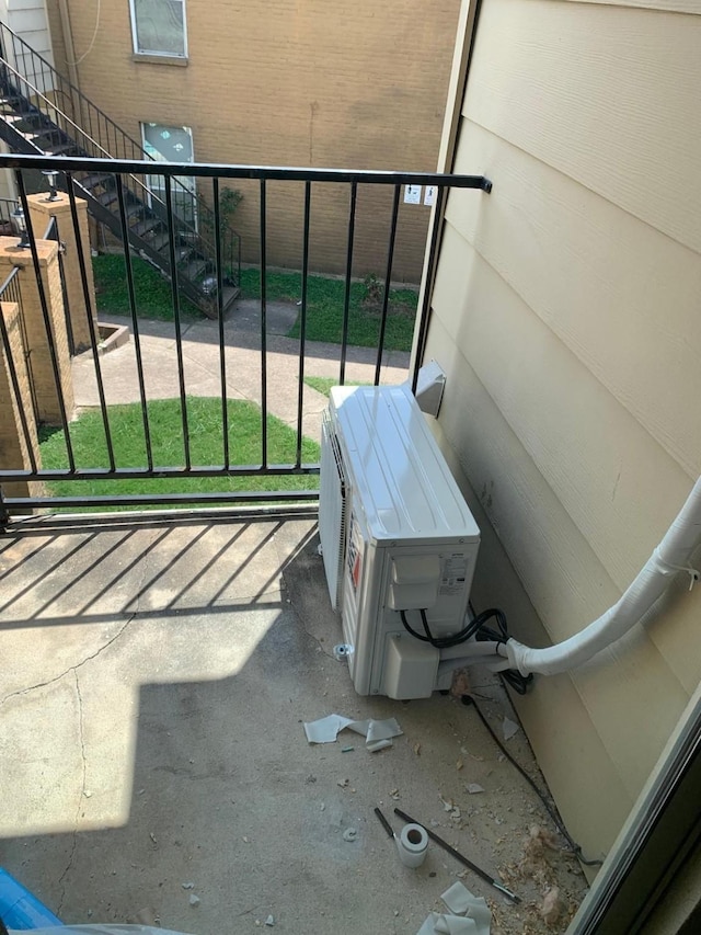 balcony featuring ac unit