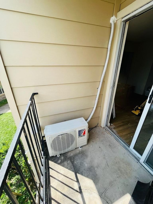 balcony featuring ac unit