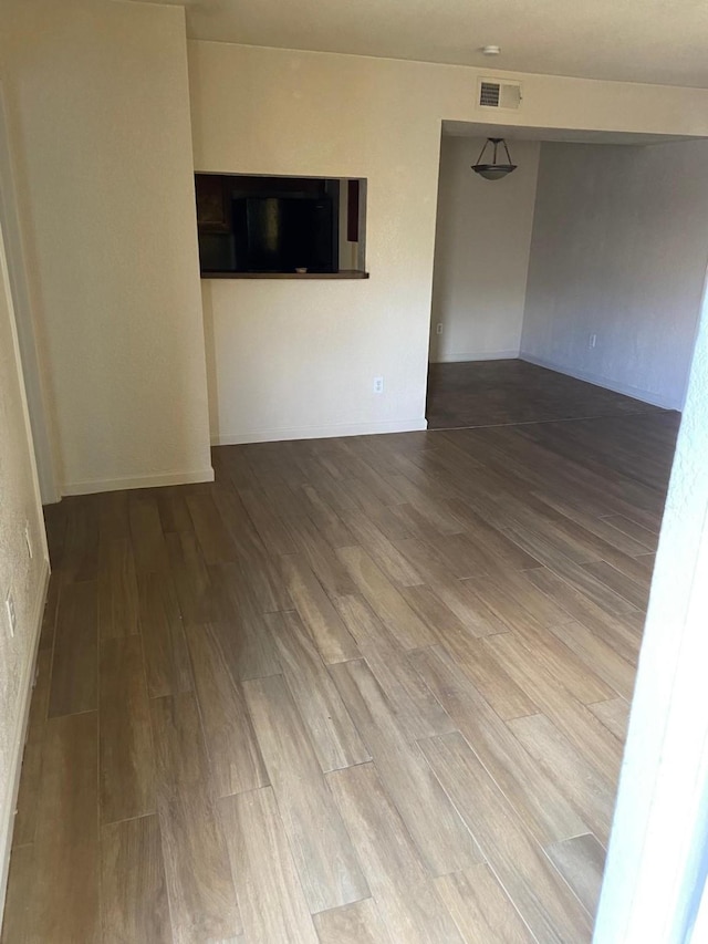 spare room with hardwood / wood-style flooring