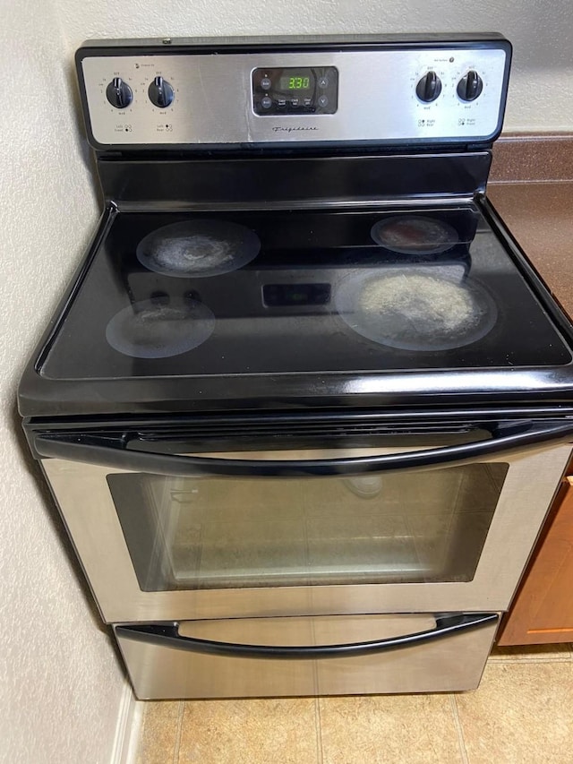 room details featuring stainless steel electric range