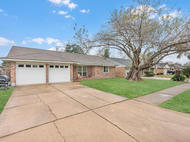 view of front of house featuring a front yard and a garage