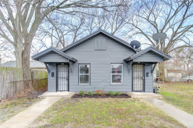 bungalow with a front yard