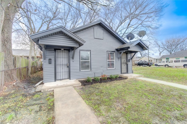 bungalow with a front yard