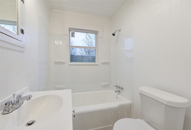 full bathroom with bathing tub / shower combination, tile walls, ornamental molding, and sink