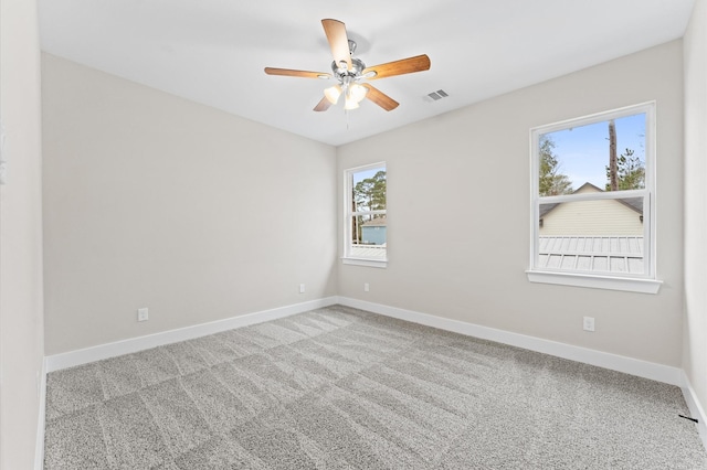 unfurnished room with light carpet and ceiling fan