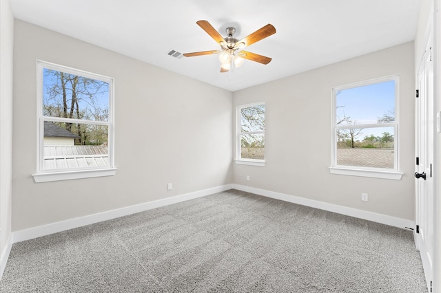 carpeted empty room with ceiling fan