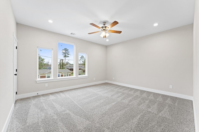 spare room with carpet flooring and ceiling fan