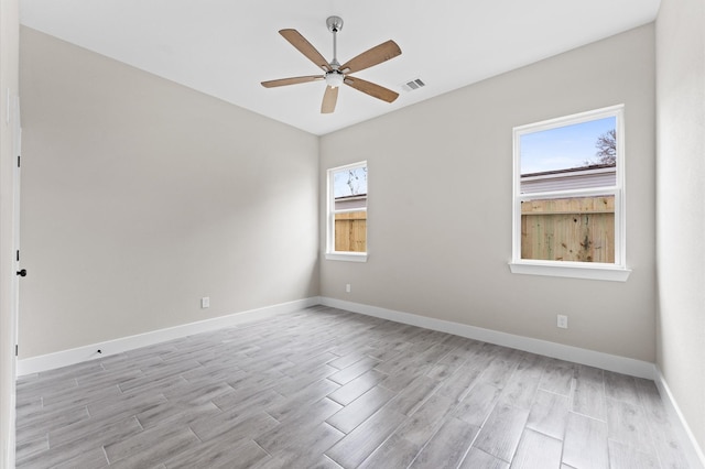 spare room with ceiling fan