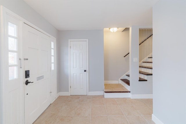 foyer with light tile patterned flooring