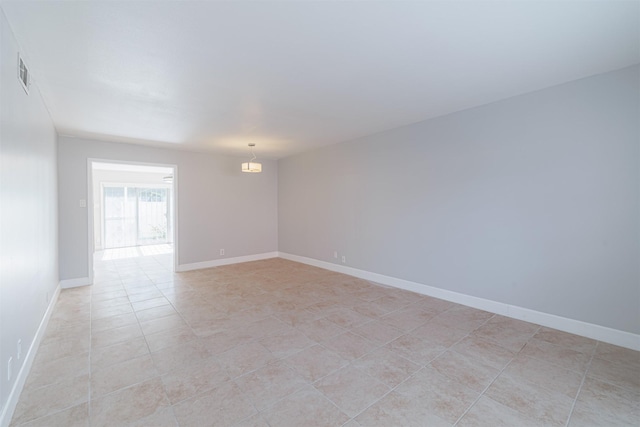 empty room with light tile patterned floors