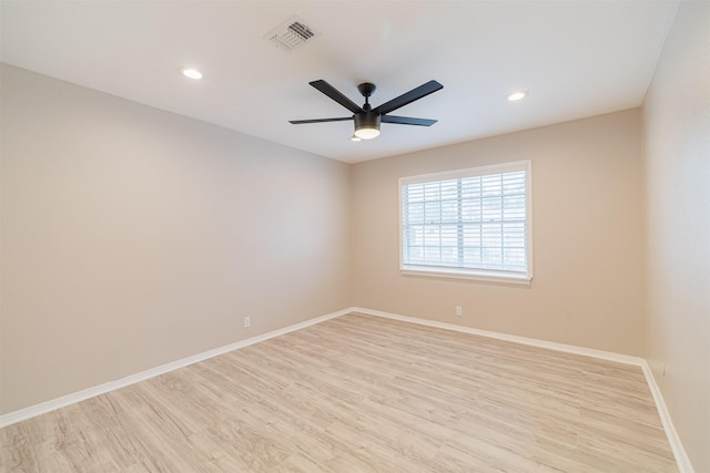 unfurnished room with ceiling fan and light hardwood / wood-style flooring