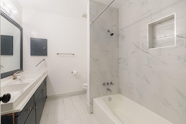 full bathroom featuring tiled shower / bath combo, toilet, and vanity