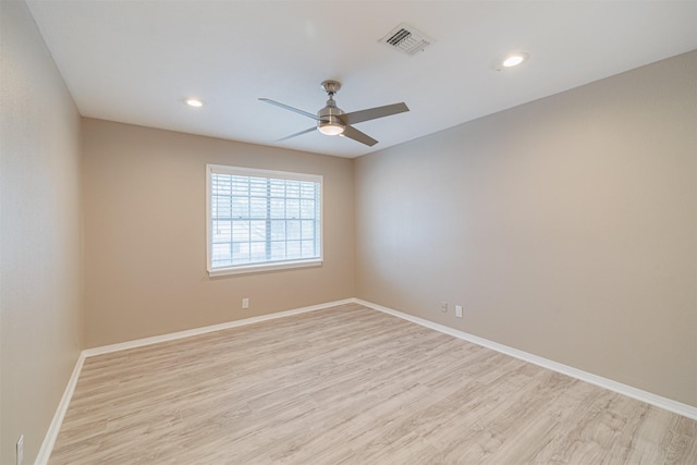 empty room with ceiling fan and light wood-type flooring