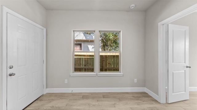 spare room with light wood-type flooring