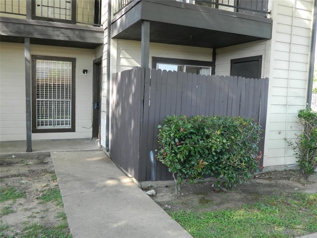 entrance to property with a balcony