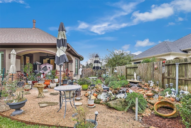 view of yard with ceiling fan