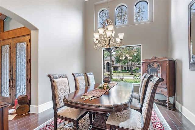 dining space featuring a chandelier and french doors