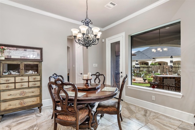 dining room with a notable chandelier and ornamental molding