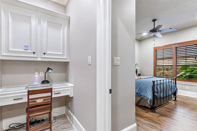 bedroom with ceiling fan and light wood-type flooring