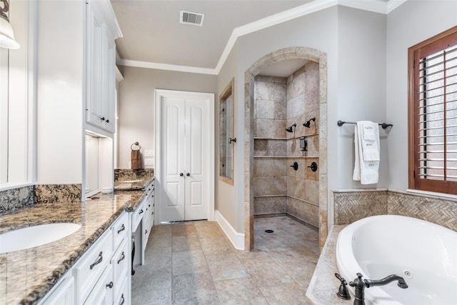 bathroom featuring plus walk in shower, vanity, and ornamental molding