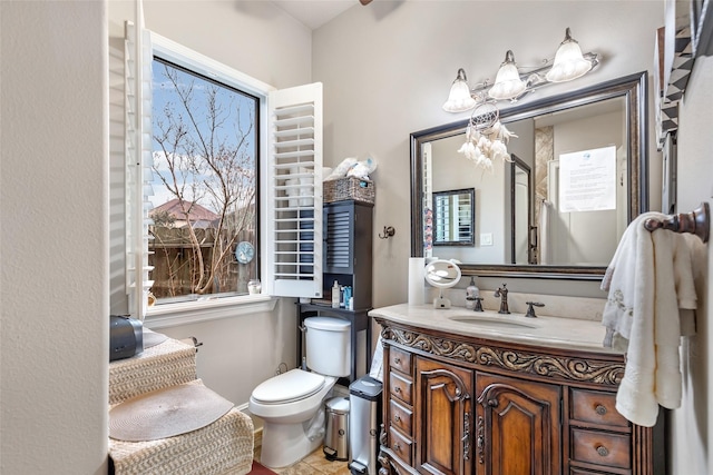 bathroom with vanity and toilet