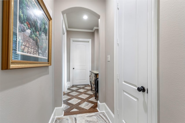 corridor featuring crown molding