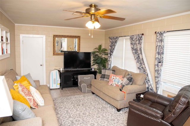 living room featuring light tile patterned floors, crown molding, and ceiling fan