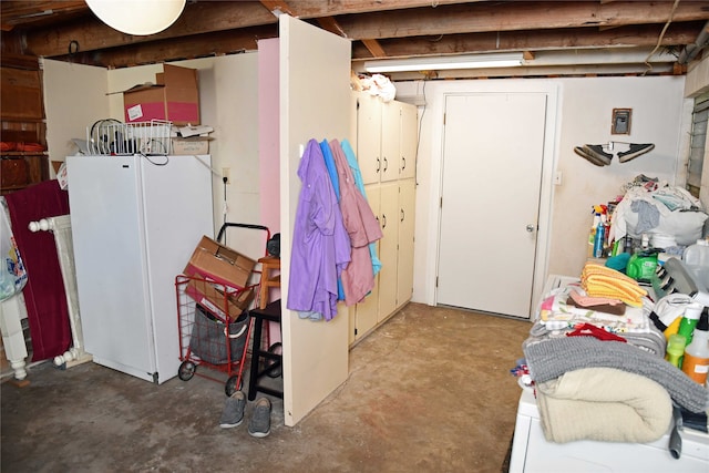 basement with white refrigerator