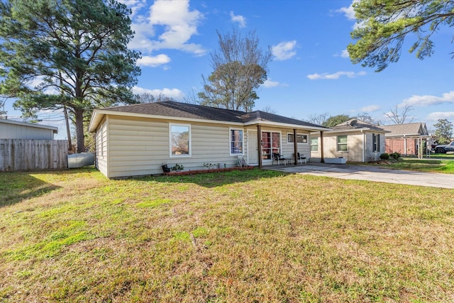 ranch-style house featuring a patio and a front lawn