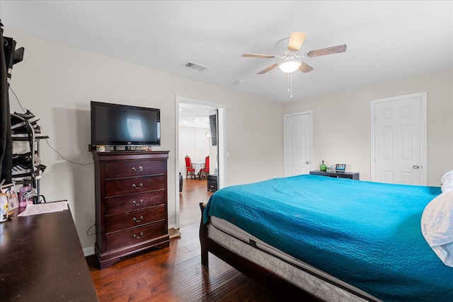 bedroom featuring dark hardwood / wood-style floors and ceiling fan