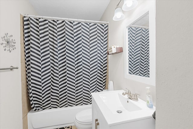 full bathroom featuring vanity, shower / bathtub combination, toilet, and a textured ceiling