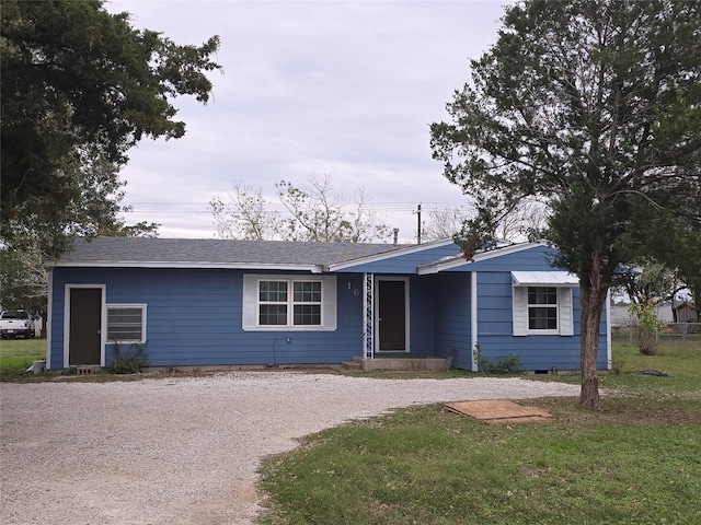 ranch-style house with a front yard