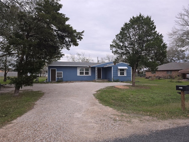 ranch-style home with a front yard