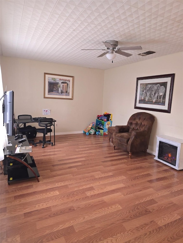 sitting room featuring hardwood / wood-style flooring