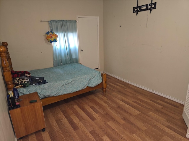 bedroom featuring hardwood / wood-style floors