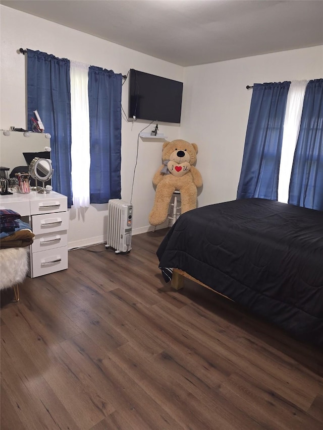 bedroom featuring dark hardwood / wood-style floors